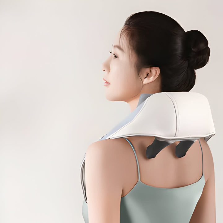 Unisex heated neck & shoulder massager in use, providing deep muscle relief & relaxation for tension.