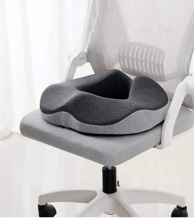 Unisex hemorrhoid donut seat cushion for pressure & pain relief. Ergonomic memory foam for tailbone support.
