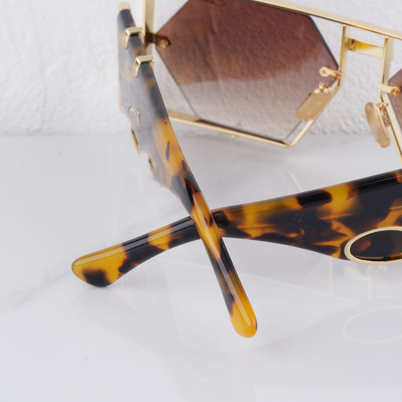 Alloy frame hexagon sunglasses, UV400 eye protection, trendy and durable accessory.