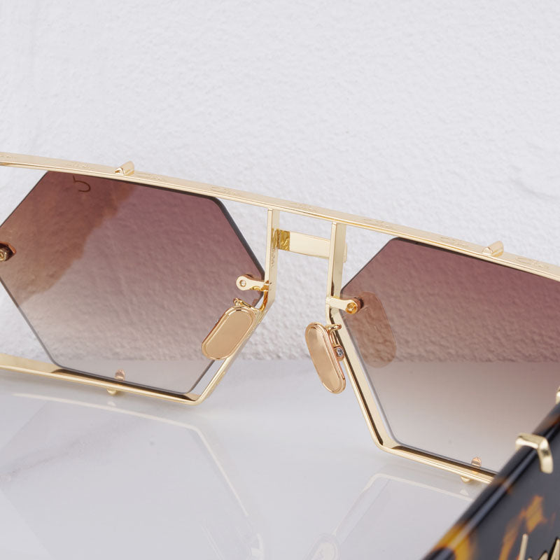 Fashionable geometric hexagon sunglasses, UV400, durable alloy frame for eye protection.