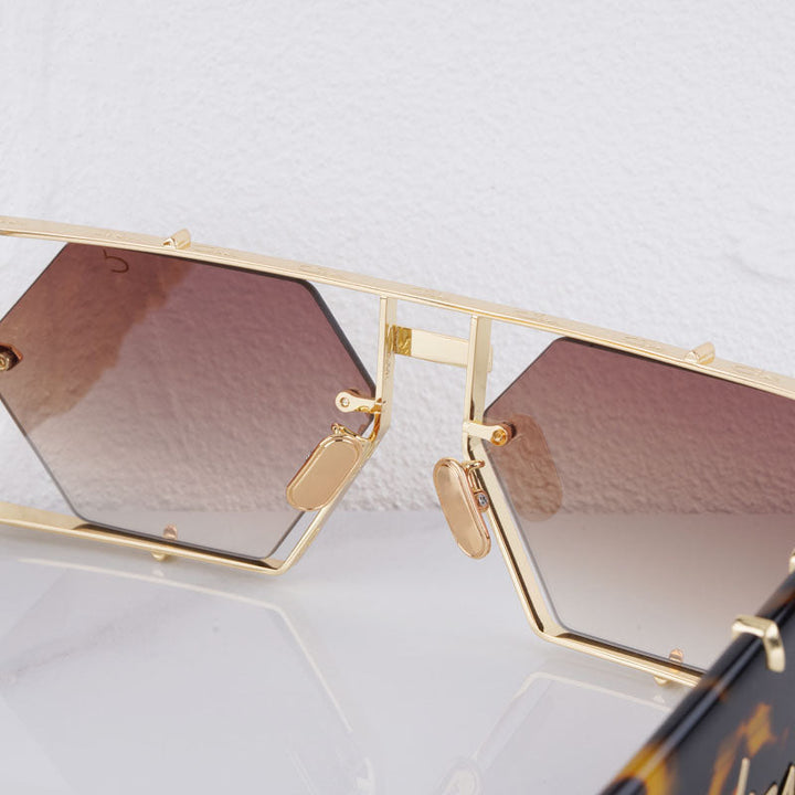 Fashionable geometric hexagon sunglasses, UV400, durable alloy frame for eye protection.