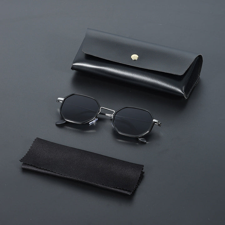Unisex hexagonal sunglasses with green UV400 lenses, offering modern style and eye protection.