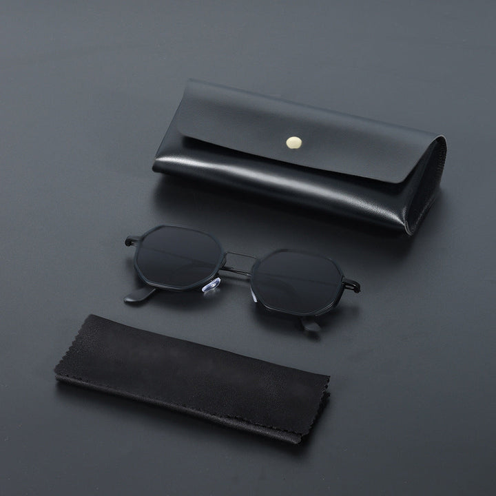 Classic unisex hexagonal sunglasses with black UV400 lenses, lightweight and modern eyewear.