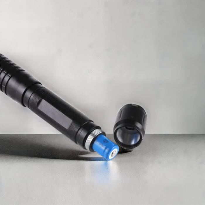 Bright blue laser tactical flashlight, high-power for precise illumination. Versatile outdoor survival & emergency lighting.