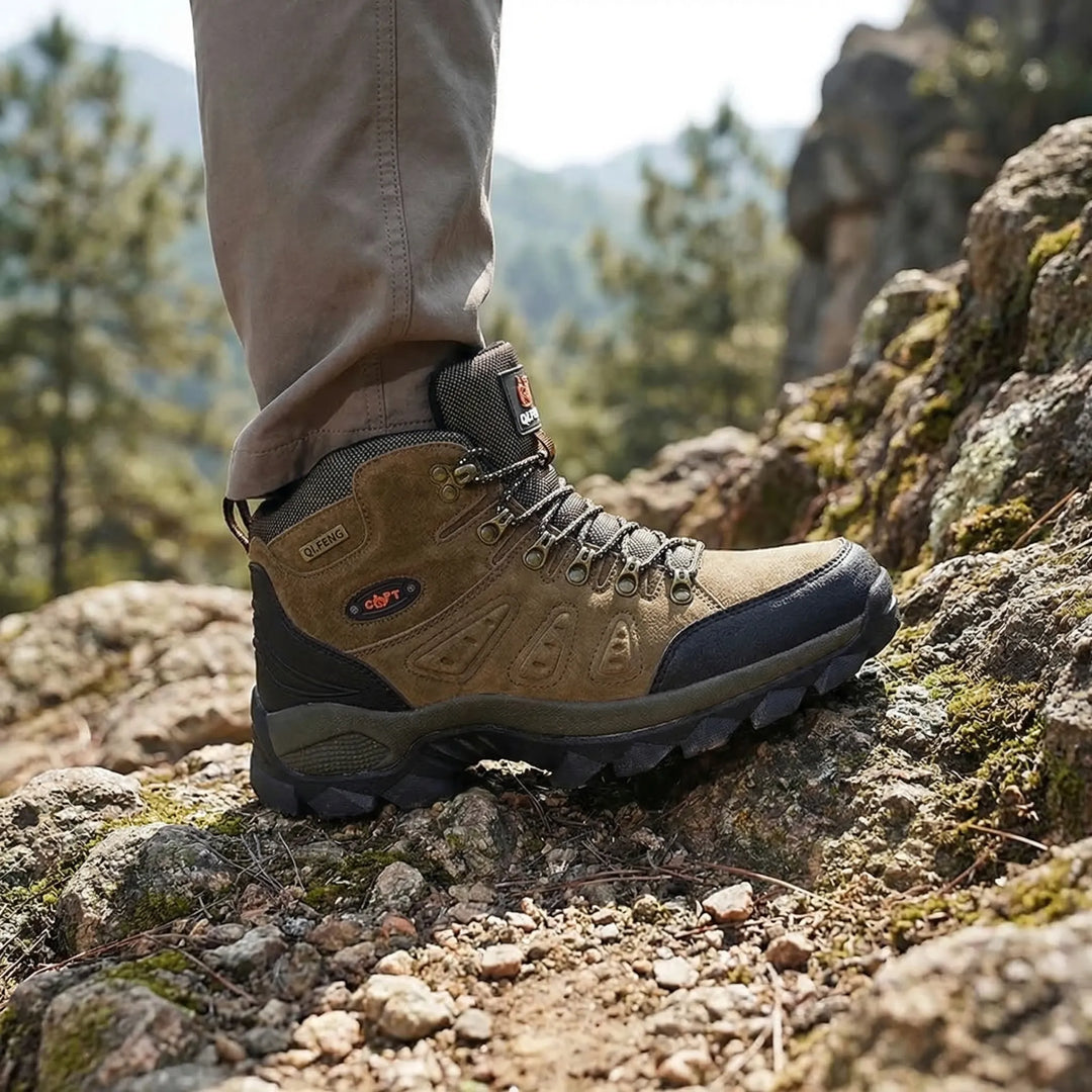Unisex high-top hiking boots with rugged outsole for superior trail grip & ankle support. Durable outdoor footwear.