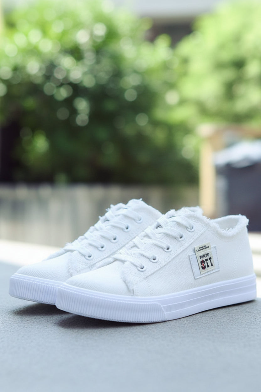 Pair of trendy unisex high-top white sneakers, ideal for comfortable everyday wear and street style.