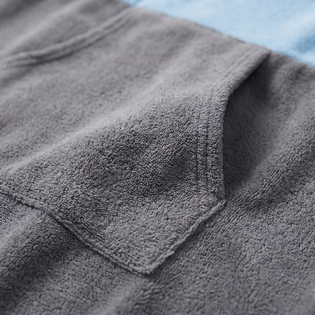 Soft, absorbent unisex hooded changing poncho, perfect for discreet beach changing & post-swim comfort.