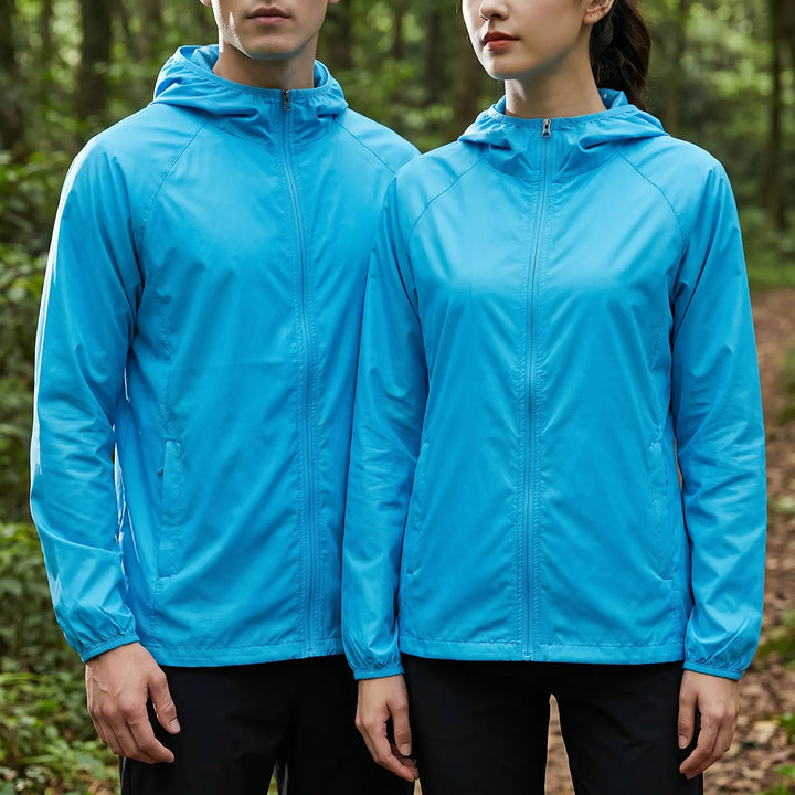 Unisex travel windbreaker, lightweight and hooded for all-weather outdoor adventures.