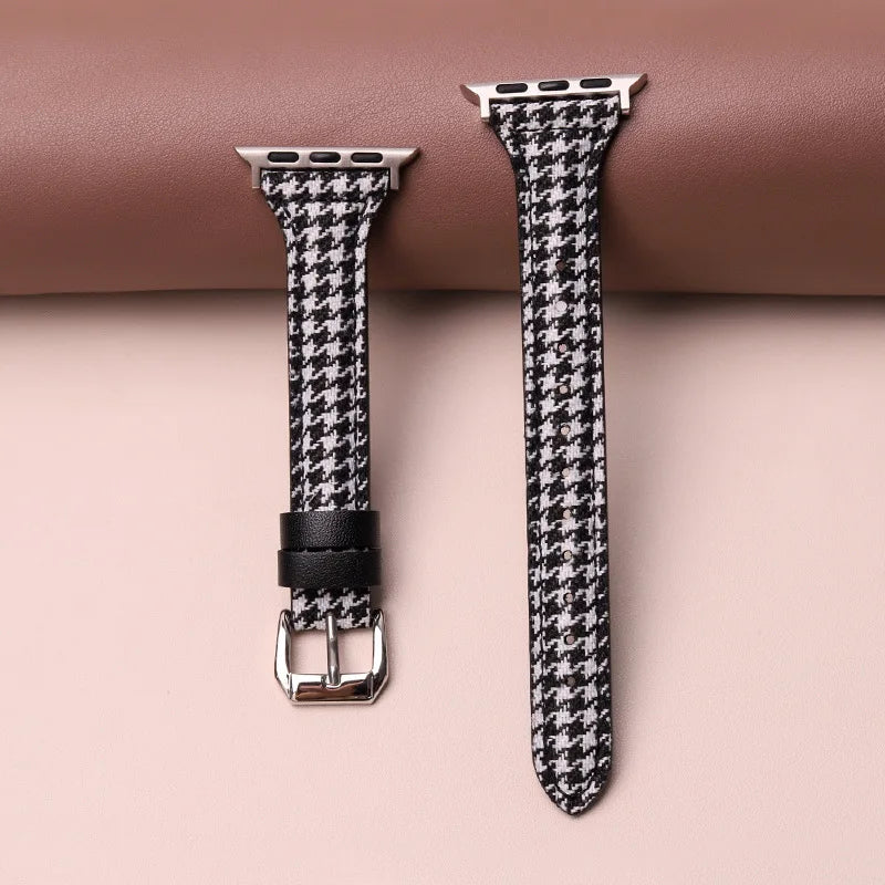 Stylish houndstooth smartwatch band. Comfortable, adjustable unisex watch accessory with a classic pattern.
