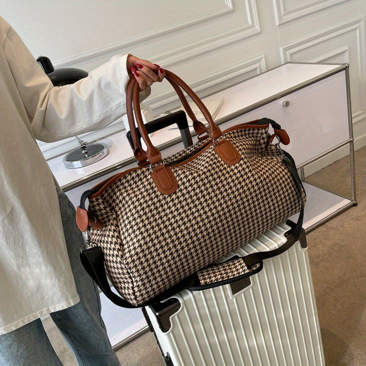Stylish black & brown houndstooth vegan leather weekender bag, perfect unisex carry-on travel luggage.