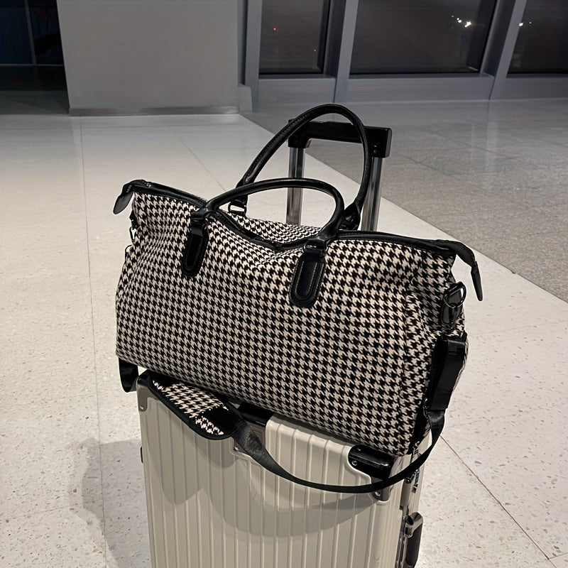 Full view of a sleek unisex houndstooth weekender travel bag. Durable vegan leather carry-on luggage for modern travelers.