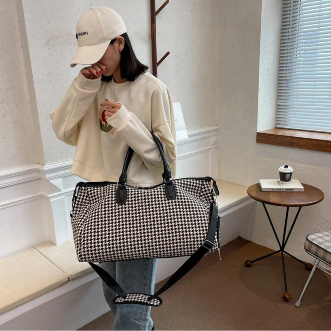 Vegan leather houndstooth weekender bag. Durable unisex travel carry-on luggage in classic black & brown design.