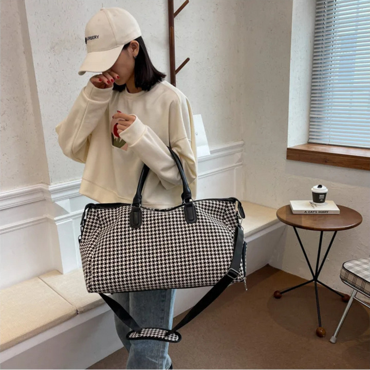 Vegan leather houndstooth weekender bag. Durable unisex travel carry-on luggage in classic black & brown design.