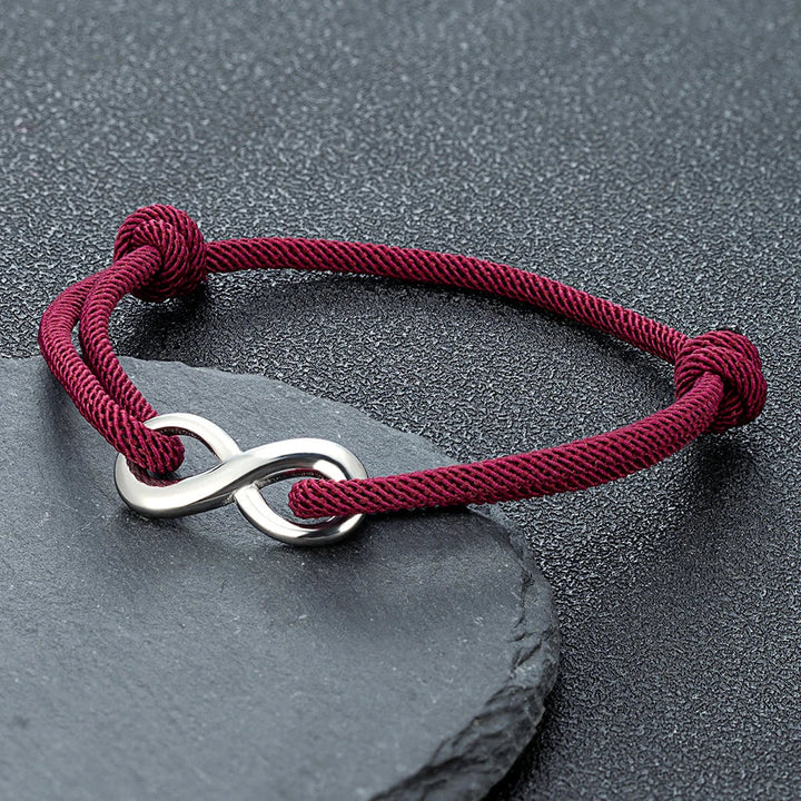 Minimalist infinity cord bracelet; adjustable stainless steel for lasting connection & style.