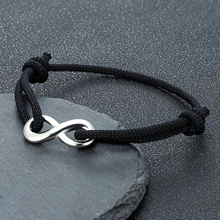 Stainless steel infinity cord bracelet; adjustable, modern unisex accessory for everyday wear.