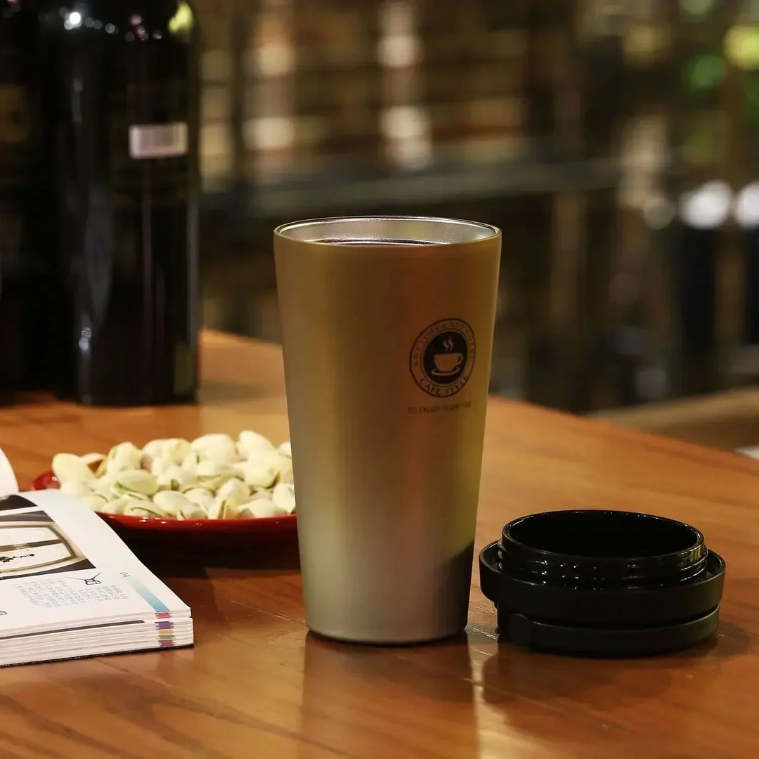 Insulated coffee travel mug, stainless steel construction for reliable hot and cold beverage retention.