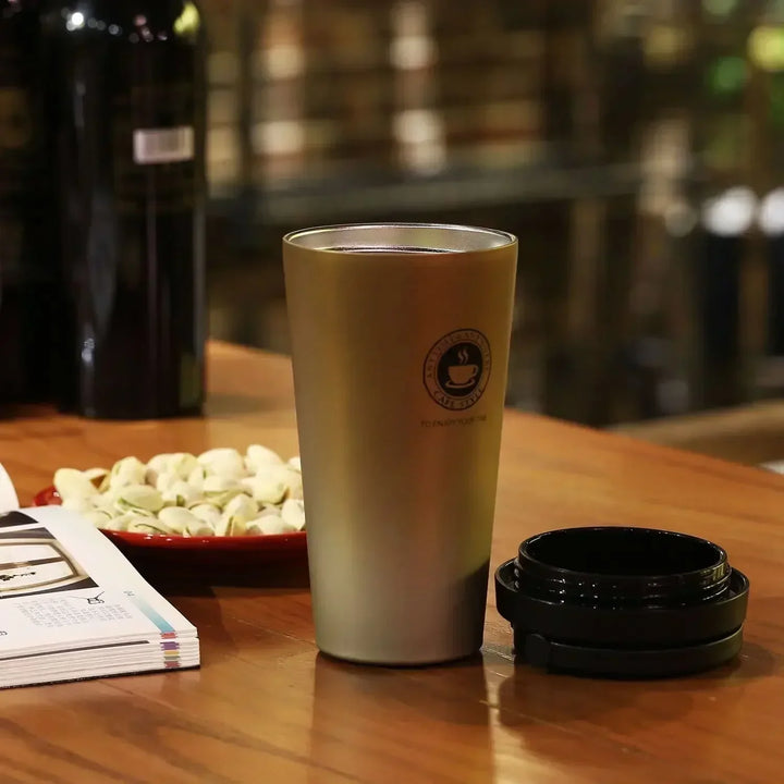 Insulated coffee travel mug, stainless steel construction for reliable hot and cold beverage retention.