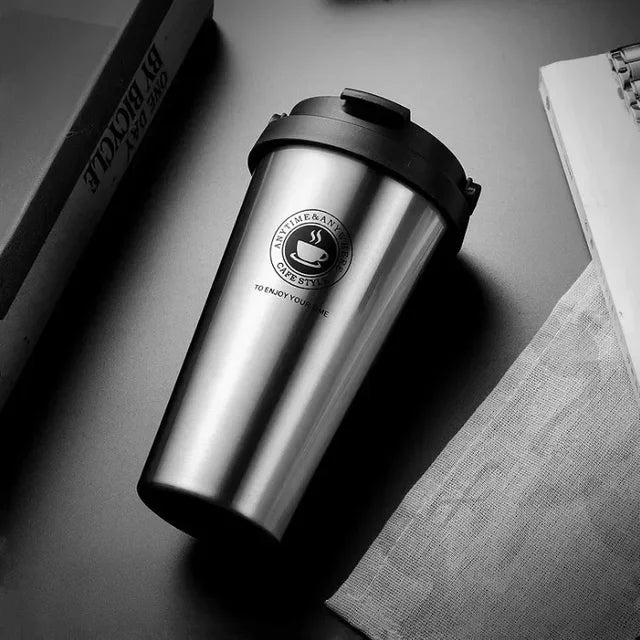 Reusable insulated travel mug, ideal for maintaining hot coffee or refreshing cold beverages.