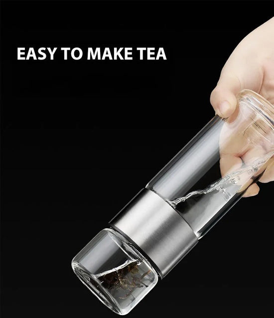 Glass water bottle with tea infuser, ideal for brewing hot tea or fruit-infused cold drinks on the go.
