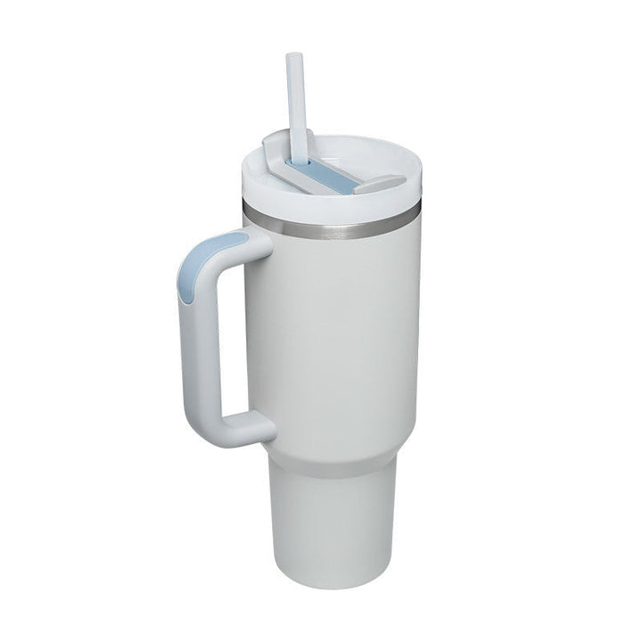 Eco-friendly insulated mug with handle & straw. Reduce waste with this reusable drinkware.