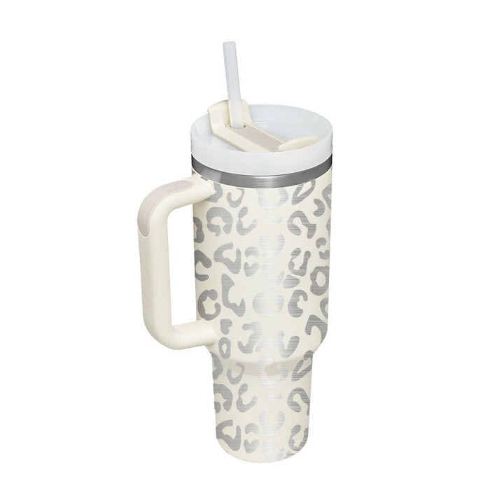 Large capacity insulated mug with handle & straw. Hydrate effortlessly with hot or cold.