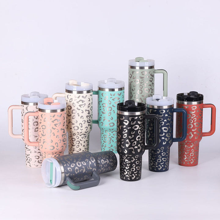 Unisex drinkware: insulated mug with handle & reusable straw for all your hot & cold needs.