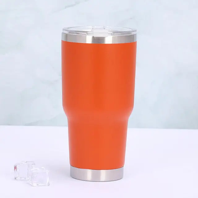 Emerald green insulated travel mug. Portable stainless steel thermos with leak-proof sliding lid, ideal for travel.