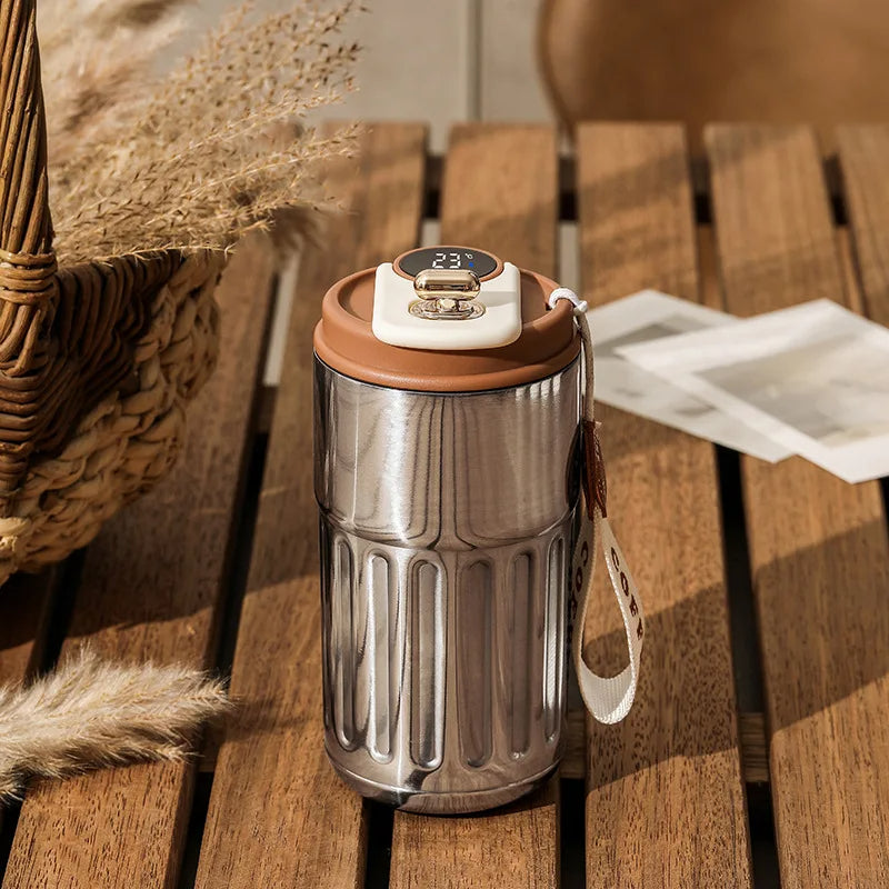 Insulated Drinkware: ThermoSip travel mug with smart temperature display. Great for hot coffee, tea, or cold water.