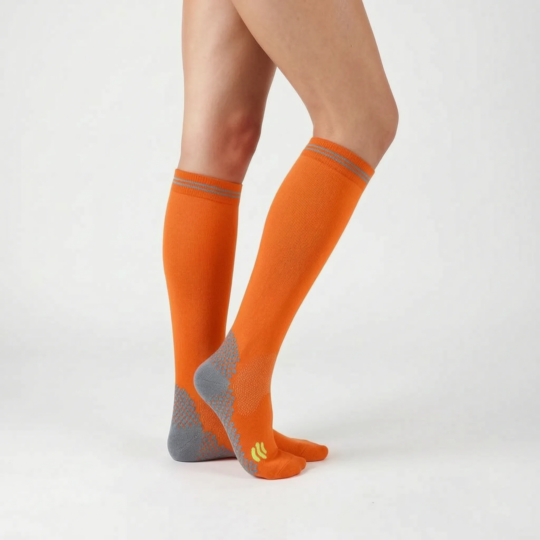 Unisex knee-high compression running socks, designed to reduce muscle fatigue and improve performance.