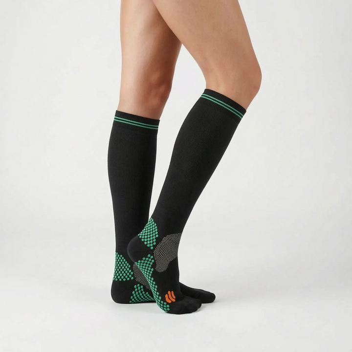 Breathable unisex knee-high athletic socks, providing targeted compression for superior leg support.