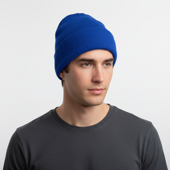 Close-up of a blue knitted winter beanie, showcasing its texture and comfortable, warm headwear.