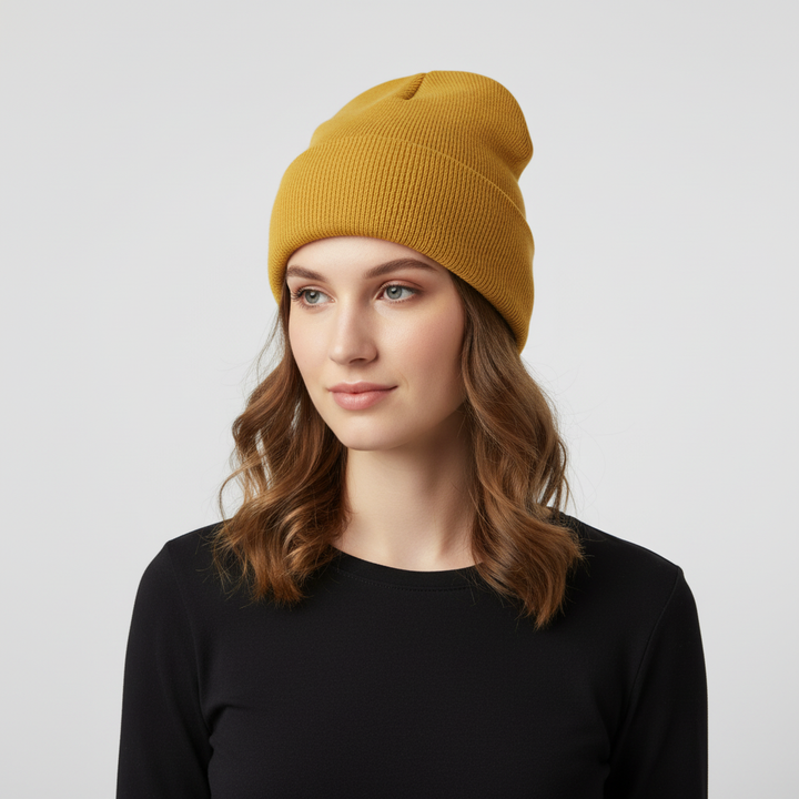 Texture detail of a dark grey knitted beanie, emphasizing its quality and warmth.