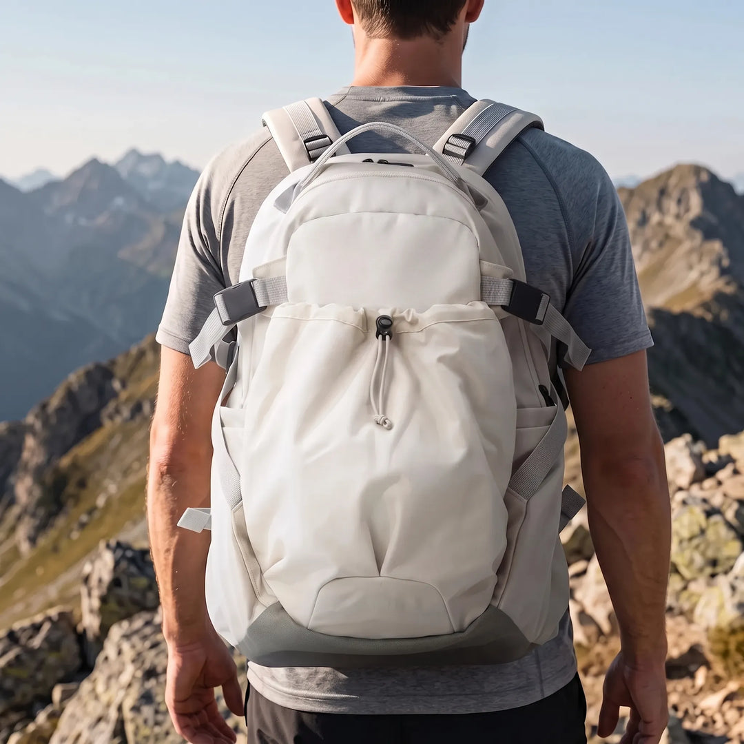 Unisex large capacity hiking backpack in an outdoor setting, perfect for camping and long treks.