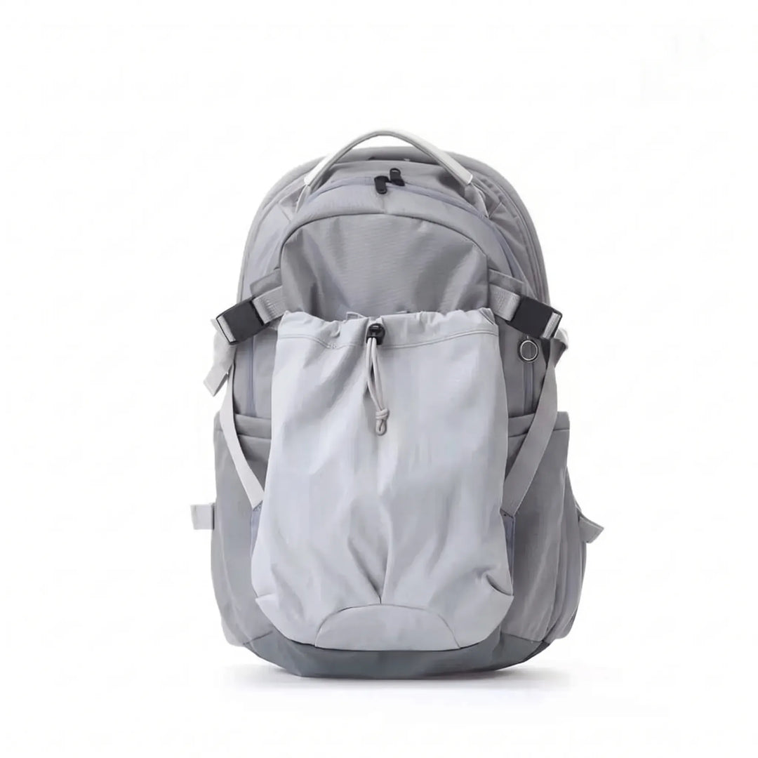 Close-up of the water-resistant fabric and secure zippers on a large outdoor hiking backpack.