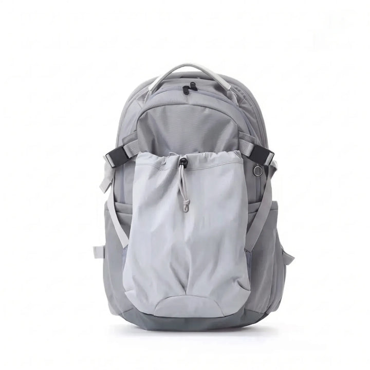 Close-up of the water-resistant fabric and secure zippers on a large outdoor hiking backpack.