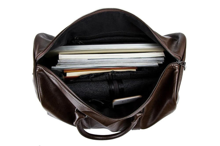 Compact yet spacious unisex PU leather duffel bag, lightweight for easy travel.