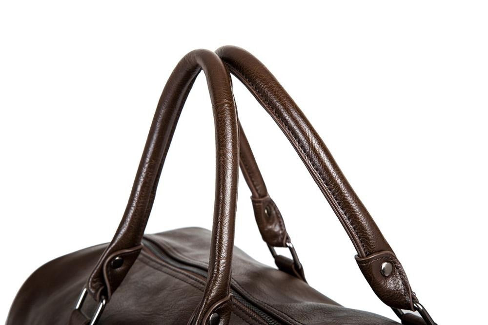 Elegant unisex PU leather travel duffel bag, lightweight carry-on for stylish journeys.