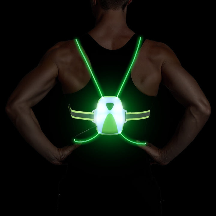 Athlete in a bright LED reflective safety vest, highly visible for safe night running, cycling & fitness.