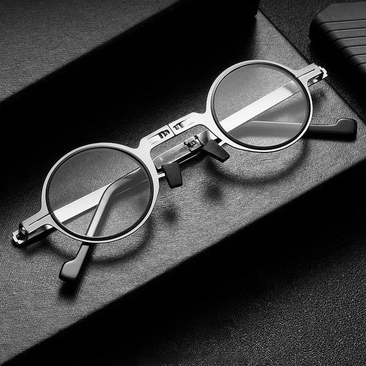 Lightweight foldable reading glasses, round frame, blue light filter. Unisex vision aid for portable use.