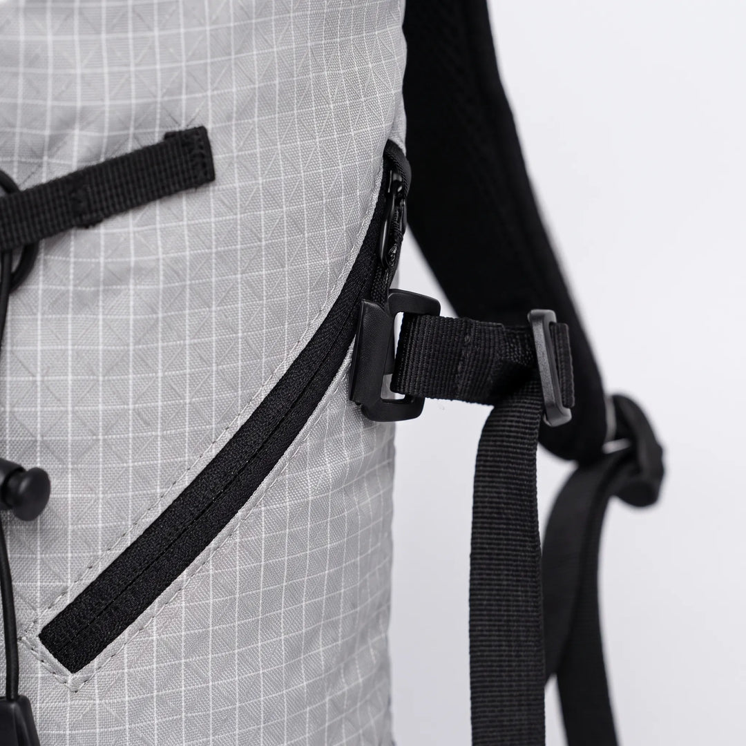 Hydration pack for hiking & camping, features water reservoir sleeve, ideal for active outdoor use.