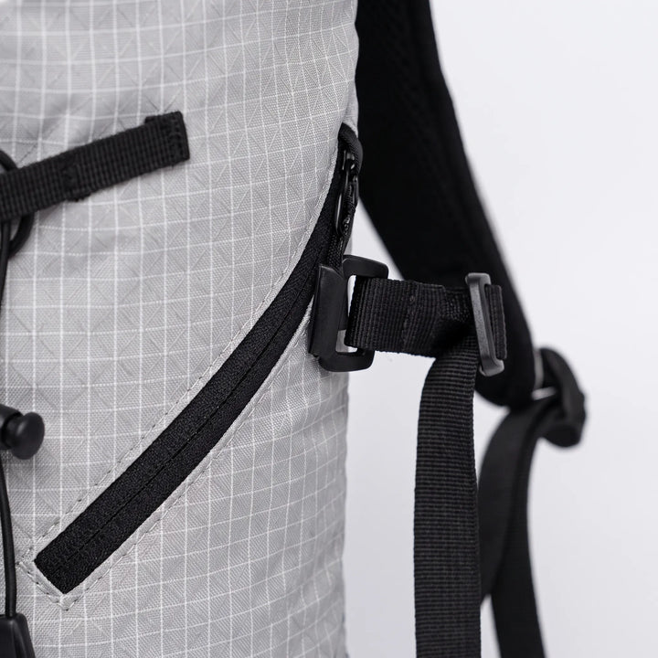 Hydration pack for hiking & camping, features water reservoir sleeve, ideal for active outdoor use.