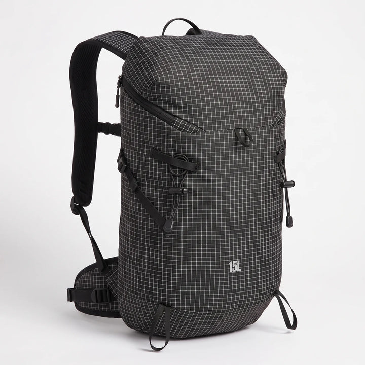 Compact hiking hydration daypack with multiple pockets, designed for essential gear on outdoor trails.