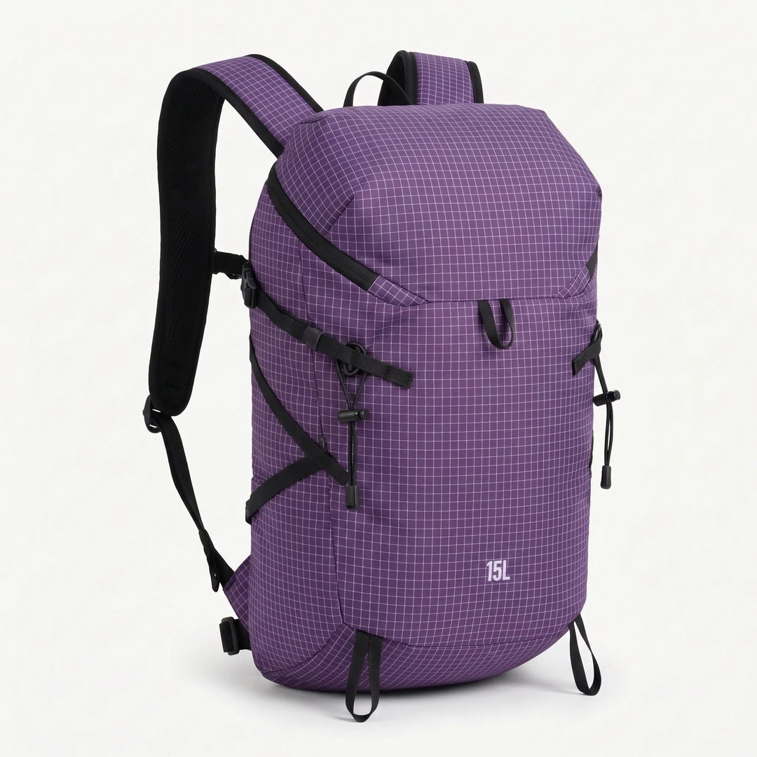Adventurer with a lightweight hydration daypack exploring a scenic outdoor trail, ready for any challenge.