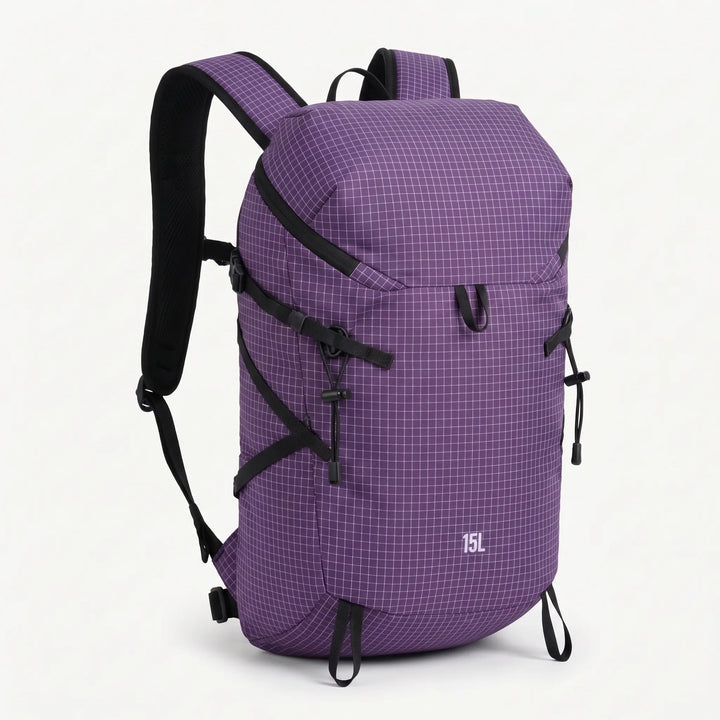 Adventurer with a lightweight hydration daypack exploring a scenic outdoor trail, ready for any challenge.