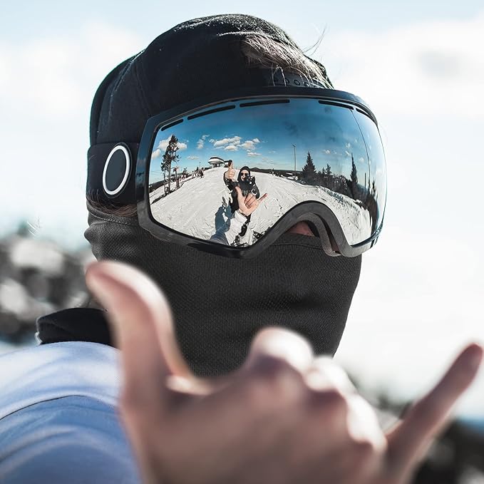 Group of skiers wearing AlpineShield UV protection ski masks on a sunny winter day