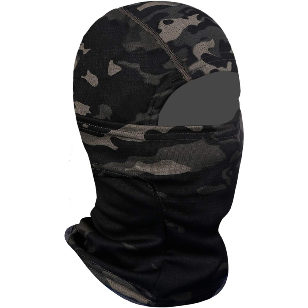 Outdoor enthusiast wearing a UV protection ski mask while cycling in mountainous terrain