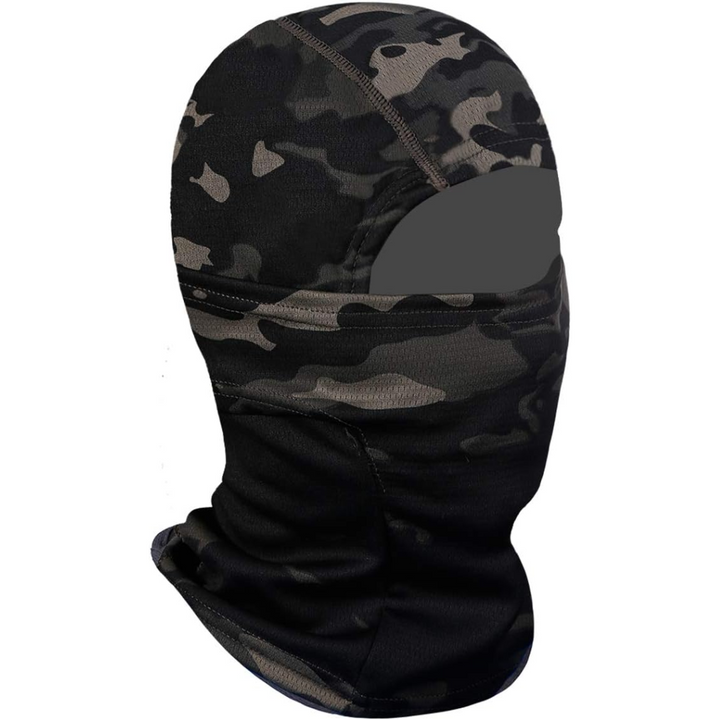 Outdoor enthusiast wearing a UV protection ski mask while cycling in mountainous terrain