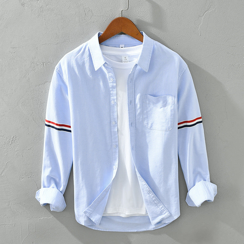 Stylish blue striped button-up shirt. Versatile unisex design, perfect for casual spring & everyday wear.