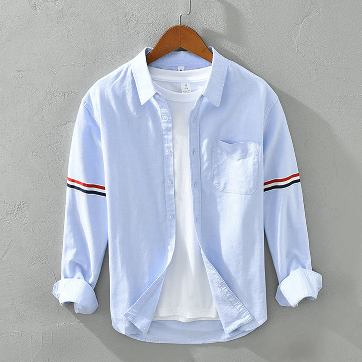 Stylish blue striped button-up shirt. Versatile unisex design, perfect for casual spring & everyday wear.