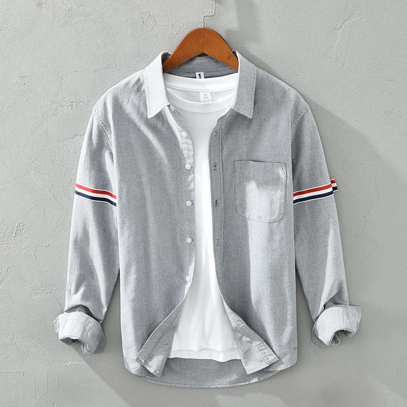 Breathable unisex striped long sleeve shirt. Lightweight casual button-up for stylish everyday comfort.